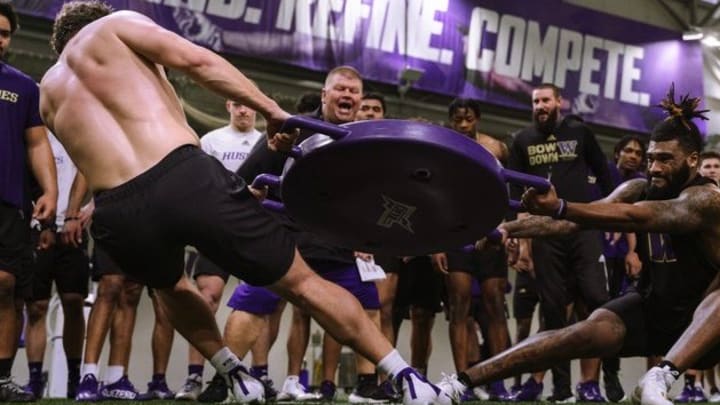 Ron McKeefery leads a UW conditioning drill in 2022.
