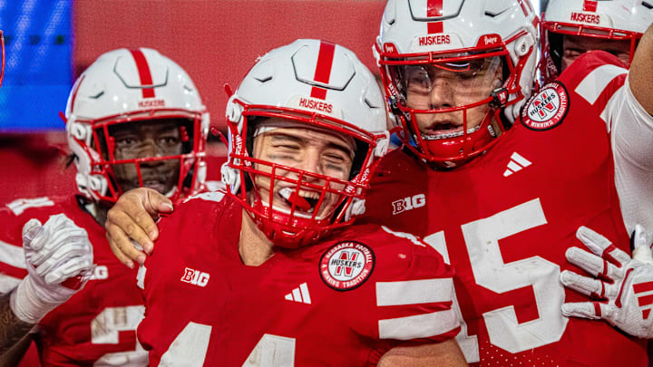 Nebraska running back Emmett Johnson (21), tight end Luke Lindenmeyer (44) and quarterback Dylan Raiola (15) celebrate after a touchdown against Akron. Nebraska running back Emmett Johnson (21), tight end Luke Lindenmeyer (44) and quarterback Dylan Raiola (15) celebrate after a touchdown against Akron.