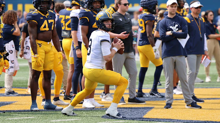 West Virginia University quarterback Nicco Marchiol drops back during a passing drill in the 2024 Gold-Blue Spring Game.