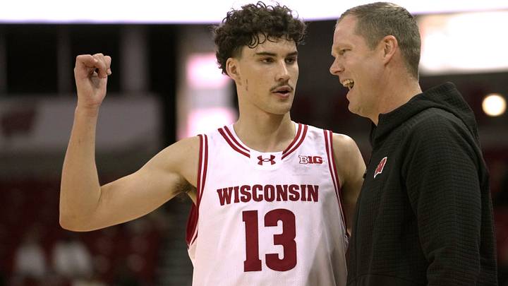 Hayden Jones (13) talks with associate head coach Joe Krabbenhoft during a Wisconsin men’s basketball scrimmage Sunday, October 19, 2025 at the Kohl Center in Madison, Wisconsin.