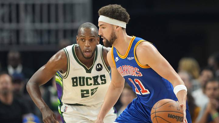Mar 12, 2022; San Francisco, California, USA; Golden State Warriors guard Klay Thompson (11) dribbles against Milwaukee Bucks forward Khris Middleton (22) during the first quarter at Chase Center. Mandatory Credit: Darren Yamashita-Imagn Images Mar 12, 2022; San Francisco, California, USA; Golden State Warriors guard Klay Thompson (11) dribbles against Milwaukee Bucks forward Khris Middleton (22) during the first quarter at Chase Center. Mandatory Credit: Darren Yamashita-Imagn Images