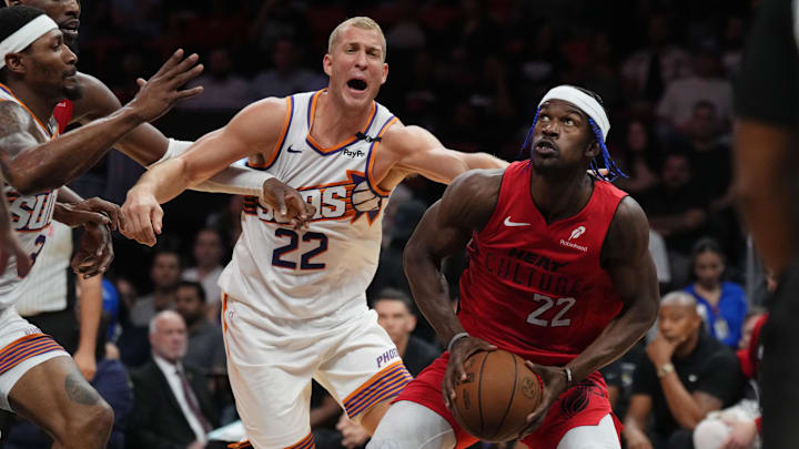 Dec 7, 2024; Miami, Florida, USA; Miami Heat forward Jimmy Butler (22) drives to the basket against Phoenix Suns center Mason Plumlee (22) during the second half at Kaseya Center. Mandatory Credit: Jim Rassol-Imagn Images Dec 7, 2024; Miami, Florida, USA; Miami Heat forward Jimmy Butler (22) drives to the basket against Phoenix Suns center Mason Plumlee (22) during the second half at Kaseya Center. Mandatory Credit: Jim Rassol-Imagn Images