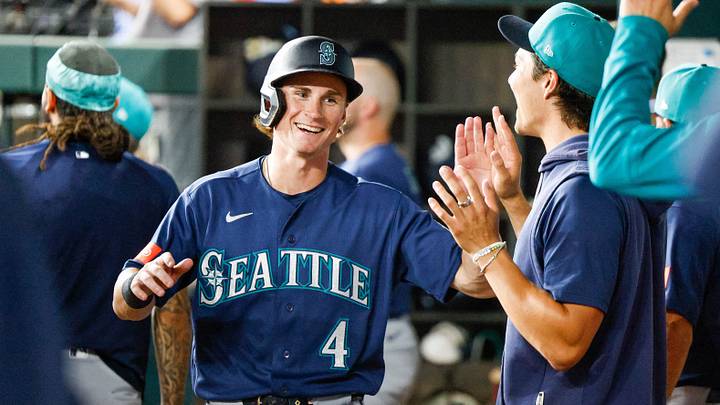 Jul 24, 2026; Arlington, Texas, USA; Seattle Mariners shortstop Colt Emerson (4) is congratulated after coming in to score during the fifth inning against the Texas Rangers at Globe Life Field. Mandatory Credit: Andrew Dieb-Imagn Images