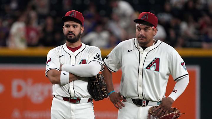 Jun 9, 2025; Phoenix, Arizona, USA; Arizona Diamondbacks third base Eugenio Suarez (28) and first base Josh Naylor (22) talk in the ninth inning against the Seattle Mariners at Chase Field. Mandatory Credit: Rick Scuteri-Imagn Images