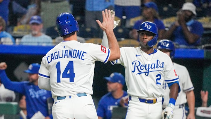 Sep 17, 2025; Kansas City, Missouri, USA; Kansas City Royals right fielder Jac Caglianone (14) celebrates with second baseman Tyler Tolbert (2) after scoring against the Seattle Mariners during the eighth inning at Kauffman Stadium. Mandatory Credit: Denny Medley-Imagn Images Sep 17, 2025; Kansas City, Missouri, USA; Kansas City Royals right fielder Jac Caglianone (14) celebrates with second baseman Tyler Tolbert (2) after scoring against the Seattle Mariners during the eighth inning at Kauffman Stadium. Mandatory Credit: Denny Medley-Imagn Images
