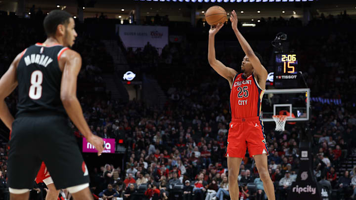 Apr 9, 2024; Portland, Oregon, USA; New Orleans Pelicans guard Trey Murphy III (25) shoots the ball as Portland Trail Blazers forward Kris Murray (8) watches in the second quarter at Moda Center. Apr 9, 2024; Portland, Oregon, USA; New Orleans Pelicans guard Trey Murphy III (25) shoots the ball as Portland Trail Blazers forward Kris Murray (8) watches in the second quarter at Moda Center.
