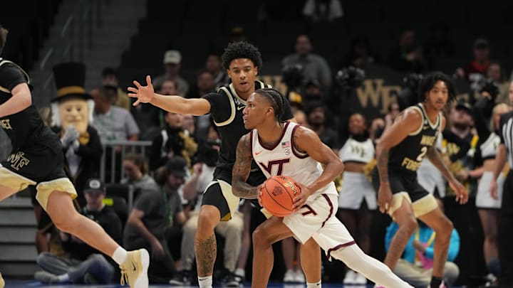 Mar 10, 2026; Charlotte, NC, USA; Virginia Tech Hokies guard Ben Hammond (3) looks to pass as Wake Forest Demon Deacons guard Myles Colvin (6) defends in the first half at Spectrum Center. Mandatory Credit: Bob Donnan-Imagn Images