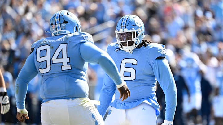 Oct 25, 2025; Chapel Hill, North Carolina, USA; North Carolina Tar Heels defensive lineman Isaiah Johnson (94) celebrtates with defensive tackle D'Antre Robinson (6) after making a sack in the second quarer at Kenan Stadium. Oct 25, 2025; Chapel Hill, North Carolina, USA; North Carolina Tar Heels defensive lineman Isaiah Johnson (94) celebrtates with defensive tackle D'Antre Robinson (6) after making a sack in the second quarer at Kenan Stadium.