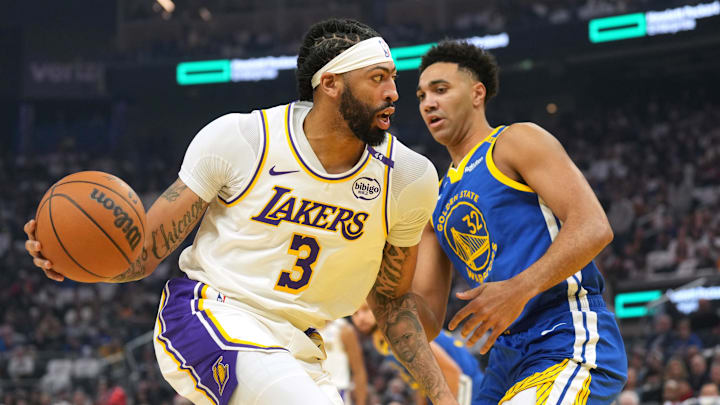 Dec 25, 2024; San Francisco, California, USA; Los Angeles Lakers forward Anthony Davis (3) dribbles against Golden State Warriors forward Trayce Jackson-Davis (32) during the first quarter at Chase Center. Dec 25, 2024; San Francisco, California, USA; Los Angeles Lakers forward Anthony Davis (3) dribbles against Golden State Warriors forward Trayce Jackson-Davis (32) during the first quarter at Chase Center.