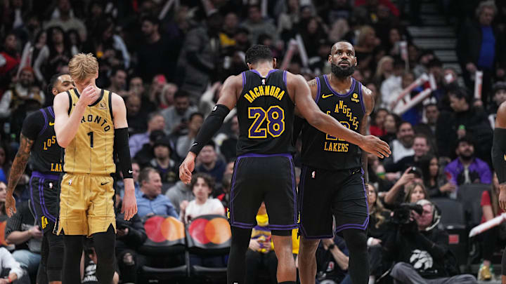 Apr 2, 2024; Toronto, Ontario, CAN; Los Angeles Lakers forward LeBron James (23) celebrates with forward Rui Hachimura (28) against the Toronto Raptors during the third quarter at Scotiabank Arena. Mandatory Credit: Nick Turchiaro-Imagn Images