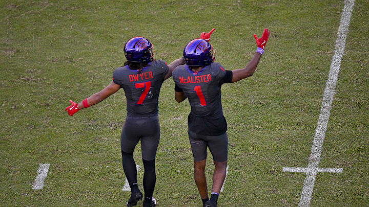 Nov 8, 2025; Fort Worth, Texas, USA; TCU Horned Frogs wide receiver Jordan Dwyer (7) and wide receiver Eric McAlister (1) point to the replay screen during the second half against the Iowa State Cyclones at Amon G. Carter Stadium. Mandatory Credit: Jerome Miron-Imagn Images