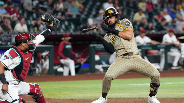May 3, 2024; Phoenix, Arizona, USA; San Diego Padres outfielder Fernando Tatis Jr. (23) dodges a pitch from Scott McGough