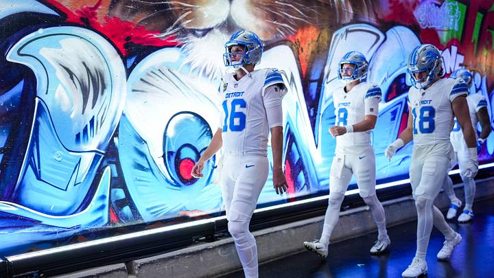 Detroit Lions quarterback Jared Goff walks down the tunnel with quarterback Kyle Allen (8) and wide receiver Isaac Teslaa (18) for warmups ahead of the Dallas Cowboys game at Ford Field in Detroit on Thursday, Dec. 4, 2025. Detroit Lions quarterback Jared Goff walks down the tunnel with quarterback Kyle Allen (8) and wide receiver Isaac Teslaa (18) for warmups ahead of the Dallas Cowboys game at Ford Field in Detroit on Thursday, Dec. 4, 2025.