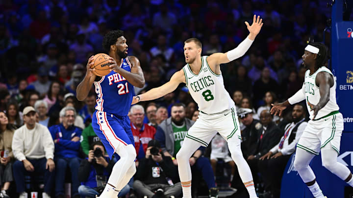Nov 8, 2023; Philadelphia, Pennsylvania, USA; Philadelphia 76ers center Joel Embiid (21) controls the ball against Boston Celtics center Kristaps Porzingis (8) in the first quarter at Wells Fargo Center. Mandatory Credit: Kyle Ross-Imagn Images