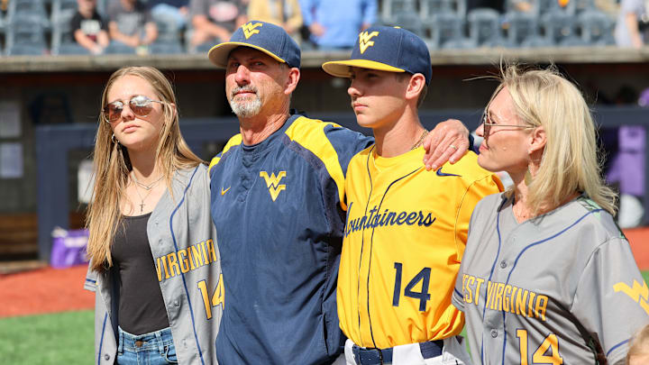 West Virginia University head coach Randy Mazey with his daughter Sierra, his son Weston and wife Amanda.