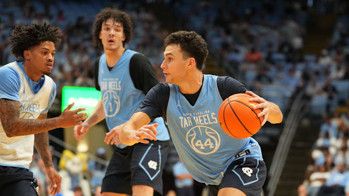 Oct 4, 2025; Charlotte, NC, USA; North Carolina Tar Heels guard Luka Bogavac (44) with the ball as guard Jonathan Powell (11) defends in the second half at Dean E. Smith Center. Oct 4, 2025; Charlotte, NC, USA; North Carolina Tar Heels guard Luka Bogavac (44) with the ball as guard Jonathan Powell (11) defends in the second half at Dean E. Smith Center.