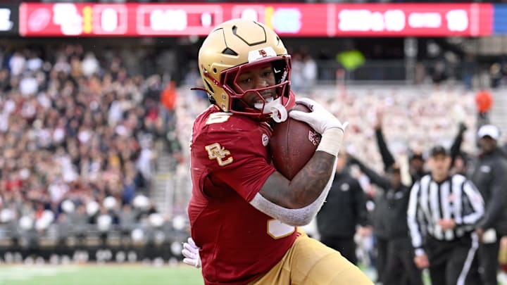 Nov 23, 2024; Chestnut Hill, Massachusetts, USA; Boston College Eagles running back Kye Robichaux (5) runs the ball against the North Carolina Tar Heels during the first half at Alumni Stadium. Mandatory Credit: Eric Canha-Imagn Images