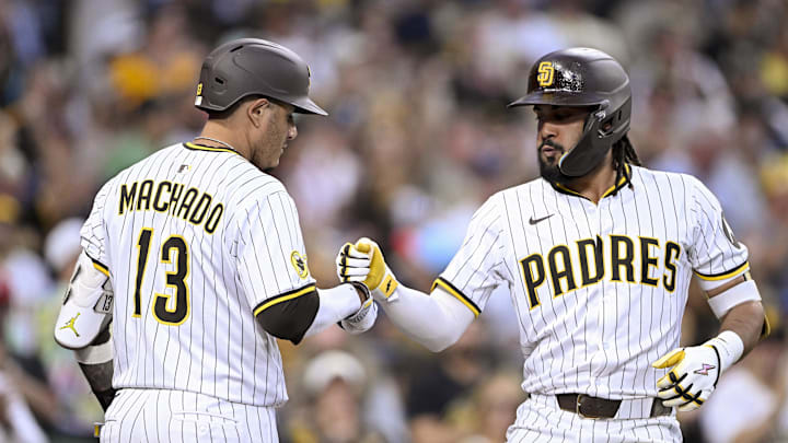 Sep 10, 2025; San Diego, California, USA; San Diego Padres right fielder Fernando Tatis Jr. (23) is congratulated by third baseman Manny Machado (13) after hitting a solo home run during the fifth inning against the Cincinnati Reds at Petco Park. Mandatory Credit: Denis Poroy-Imagn Images Sep 10, 2025; San Diego, California, USA; San Diego Padres right fielder Fernando Tatis Jr. (23) is congratulated by third baseman Manny Machado (13) after hitting a solo home run during the fifth inning against the Cincinnati Reds at Petco Park. Mandatory Credit: Denis Poroy-Imagn Images