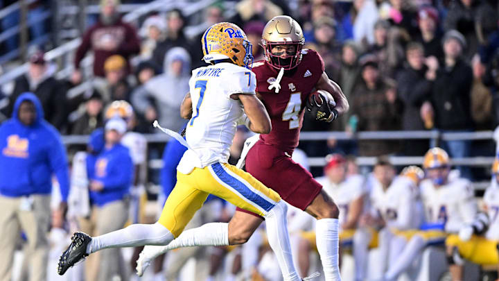Nov 30, 2024; Chestnut Hill, Massachusetts, USA; Boston College Eagles wide receiver Reed Harris (4) runs against Pittsburgh Panthers defensive back Javon McIntyre (7) during the first half at Alumni Stadium. Mandatory Credit: Brian Fluharty-Imagn Images