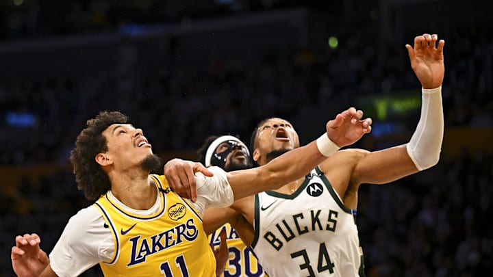 Mar 20, 2025; Los Angeles, California, USA; Milwaukee Bucks forward Giannis Antetokounmpo (34) looks to rebound against Los Angeles Lakers center Jaxson Hayes (11) and guard Jordan Goodwin (30) during the first half at Crypto.com Arena. Mandatory Credit: Jonathan Hui-Imagn Images Mar 20, 2025; Los Angeles, California, USA; Milwaukee Bucks forward Giannis Antetokounmpo (34) looks to rebound against Los Angeles Lakers center Jaxson Hayes (11) and guard Jordan Goodwin (30) during the first half at Crypto.com Arena. Mandatory Credit: Jonathan Hui-Imagn Images
