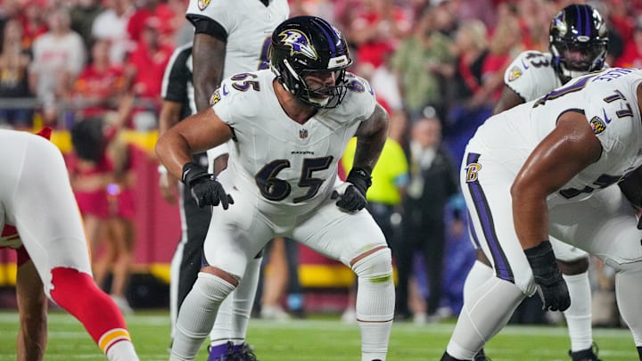 Sep 5, 2024; Kansas City, Missouri, USA; Baltimore Ravens guard Patrick Mekari (65) at the line of scrimmage against the Kansas City Chiefs during the game at GEHA Field at Arrowhead Stadium. Mandatory Credit: Denny Medley-Imagn Images