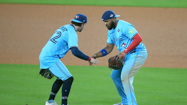 Oct 29, 2025; Los Angeles, California, USA; Toronto Blue Jays first baseman Vladimir Guerrero Jr. (27) celebrates with third baseman Ernie Clement (22) after defeating the Los Angeles Dodgers in game five of the 2025 MLB World Series at Dodger Stadium. Mandatory Credit: Kirby Lee-Imagn Images Oct 29, 2025; Los Angeles, California, USA; Toronto Blue Jays first baseman Vladimir Guerrero Jr. (27) celebrates with third baseman Ernie Clement (22) after defeating the Los Angeles Dodgers in game five of the 2025 MLB World Series at Dodger Stadium. Mandatory Credit: Kirby Lee-Imagn Images