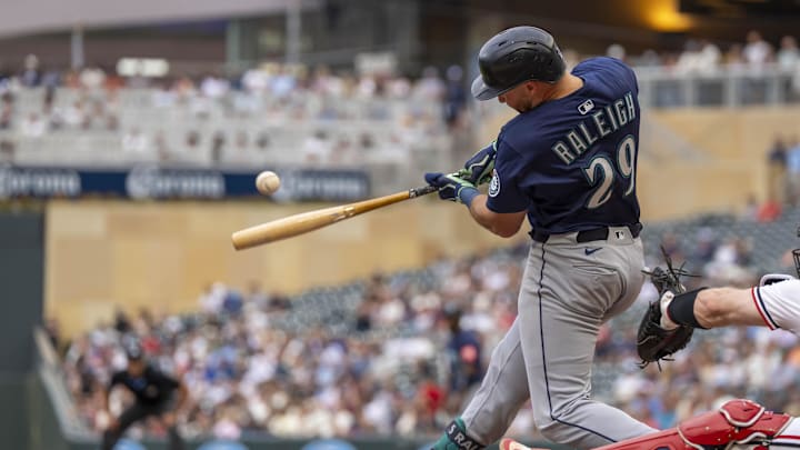 Seattle Mariners catcher Cal Raleigh (29) hits a RBI single against the Minnesota Twins in the third inning at Target Field on June 24.
