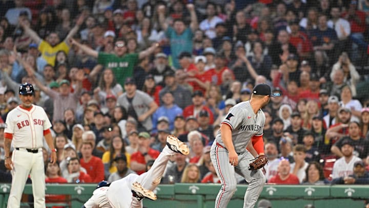 Boston Red Sox first baseman Triston Casas (36) is injured running to first base  against Minnesota Twins first baseman Ty France (13) during the second inning at Fenway Park on May 2.