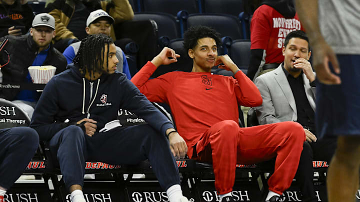 Feb 19, 2025; Chicago, Illinois, USA;  St. John's basketball guard Jaiden Glover (11) and St. John's Red Storm guard RJ Luis Jr. (12) sit on the bench during warmups before there game against DePaul Blue Demons at Wintrust Arena.