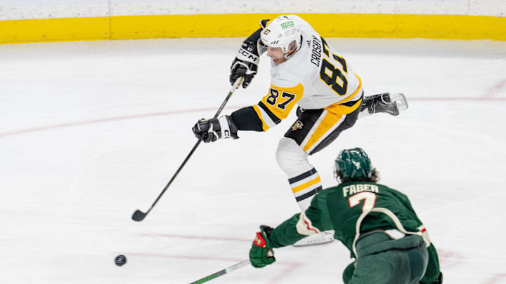 Feb 9, 2024; Saint Paul, Minnesota, USA; Pittsburgh Penguins center Sidney Crosby (87) shoots as Minnesota Wild defenseman Brock Faber (7) defends in the second period at Xcel Energy Center. Mandatory Credit: Matt Blewett-Imagn Images Feb 9, 2024; Saint Paul, Minnesota, USA; Pittsburgh Penguins center Sidney Crosby (87) shoots as Minnesota Wild defenseman Brock Faber (7) defends in the second period at Xcel Energy Center. Mandatory Credit: Matt Blewett-Imagn Images