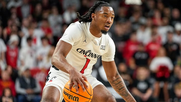 Cincinnati Bearcats guard Day Day Thomas (1) drives in the first half of the NCAA basketball game between the Cincinnati Bearcats and the West Virginia Mountaineers at Fifth Third Arena in Cincinnati on Sunday, Feb. 2, 2025.