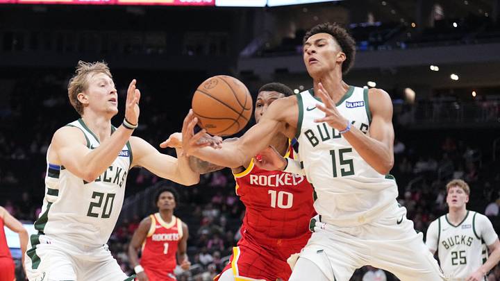 Oct 28, 2026; Milwaukee, Wisconsin, USA; Milwaukee Bucks guard AJ Green (20), Houston Rockets forward Jabari Smith Jr. (10) and Milwaukee Bucks forward Nate Ament (15) battle for possession of the ball in the first half at Fiserv Forum. Mandatory Credit: Michael McLoone-Imagn Images Oct 28, 2026; Milwaukee, Wisconsin, USA; Milwaukee Bucks guard AJ Green (20), Houston Rockets forward Jabari Smith Jr. (10) and Milwaukee Bucks forward Nate Ament (15) battle for possession of the ball in the first half at Fiserv Forum. Mandatory Credit: Michael McLoone-Imagn Images