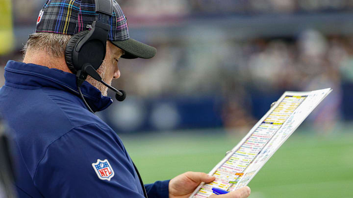 Oct 13, 2024; Arlington, Texas, USA; Dallas Cowboys Head Coach Mike McCarthy looks over his play chart during the first quarter against the Detroit Lions at AT&T Stadium. Mandatory Credit: Andrew Dieb-Imagn Images