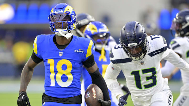 Jan 5, 2025; Inglewood, California, USA; Los Angeles Rams wide receiver Tyler Johnson (18) is chased down by Seattle Seahawks linebacker Ernest Jones IV (13) as he runs for a first down in the second half at SoFi Stadium.