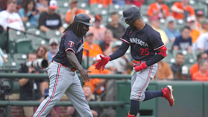 May 15, 2025; Baltimore, Maryland, USA; Minnesota Twins outfielder Byron Buxton (25) greeted by coach Tommy Watkins (40) following his solo home run during the third inning against the Baltimore Orioles at Oriole Park at Camden Yards.