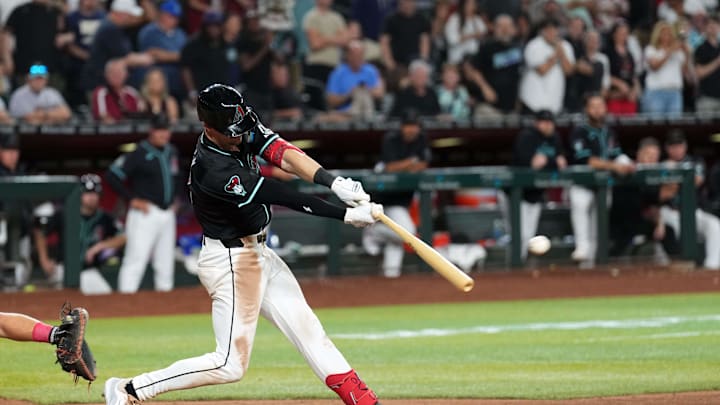 May 13, 2024; Phoenix, Arizona, USA; Arizona Diamondbacks shortstop Kevin Newman (18) hits a walk off single Vs. the Cincinnati Reds May 13, 2024; Phoenix, Arizona, USA; Arizona Diamondbacks shortstop Kevin Newman (18) hits a walk off single Vs. the Cincinnati Reds