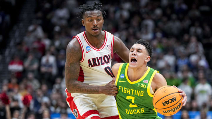 Mar 23, 2025; Seattle, WA, USA;  Oregon Ducks guard Jackson Shelstad (3) dribbles the ball against Arizona Wildcats guard Jaden Bradley (0) in the second half at Climate Pledge Arena. Mandatory Credit: Stephen Brashear-Imagn Images