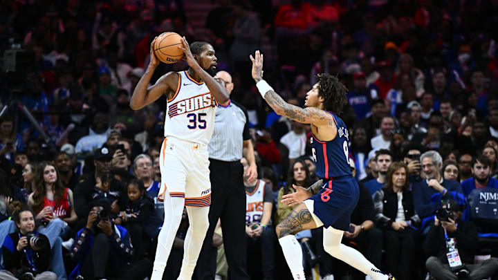 Nov 4, 2023; Philadelphia, Pennsylvania, USA; Phoenix Suns forward Kevin Durant (35) controls the ball against Philadelphia 76ers guard Kelly Oubre Jr (9) in the third quarter at Wells Fargo Center. Mandatory Credit: Kyle Ross-Imagn Images