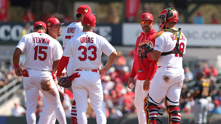 Mar 1, 2026; Jupiter, Florida, USA;  St. Louis Cardinals manager Oliver Marmol (37) speaks to catcher Ivan Herrera (48) during a pitching change against the Pittsburgh Pirates during the third inning at Roger Dean Chevrolet Stadium. Mandatory Credit: Sam Navarro-Imagn Images