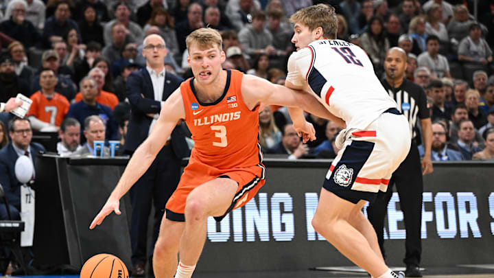 Mar 30, 2024; Boston, MA, USA;Illinois Fighting Illini forward Marcus Domask (3) dribbles the ball against Connecticut Huskies guard Cam Spencer (12) in the finals of the East Regional of the 2024 NCAA Tournament at TD Garden. Mandatory Credit: Brian Fluharty-Imagn Images