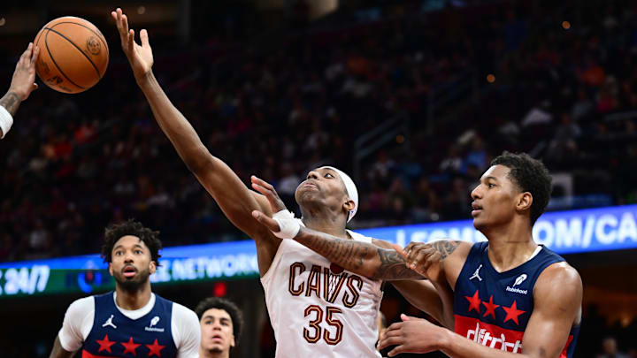 Apr 12, 2026; Cleveland, Ohio, USA; Cleveland Cavaliers forward Nae'qwan Tomlin (35) goes for a rebound against Washington Wizards forward Juju Reese (15) during the second half at Rocket Arena. Mandatory Credit: Ken Blaze-Imagn Images