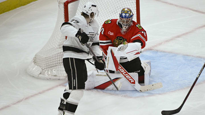 Mar 3, 2025; Chicago, Illinois, USA;  Chicago Blackhawks goaltender Spencer Knight defends against Los Angeles Kings left wing Warren Foegele (37) during the second period at the United Center. Mandatory Credit: Matt Marton-Imagn Images