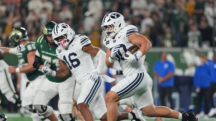 Sep 19, 2026; Fort Collins, Colorado, USA;  BYU Cougars defensive end Hunter Clegg (90) returns an interception against the Colorado State Rams at Sonny Lubick Field at Canvas Stadium.  Mandatory Credit: Andrew Rydland-Imagn Images
