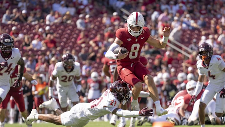 Oct 5, 2024; Stanford, California, USA;  Stanford Cardinal quarterback Justin Lamson (8) runs the ball against Virginia Tech Hokies safety Quentin Reddish (21) during the first quarter at Stanford Stadium. Mandatory Credit: Stan Szeto-Imagn Images