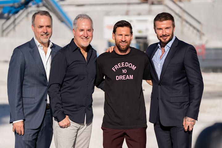 Lionel Messi poses with owners of Inter Miami