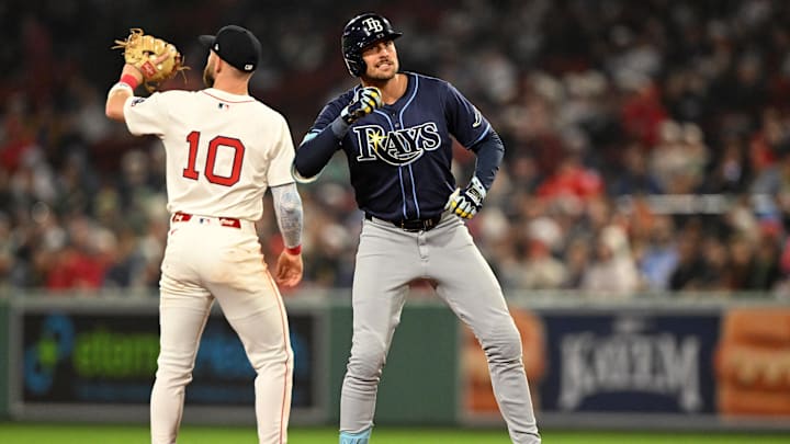 Boston, Massachusetts, USA; Tampa Bay Rays outfielder Josh Lowe (15) reacts after hitting a RBI double against the Boston Red Sox during the seventh inning at Fenway Park.