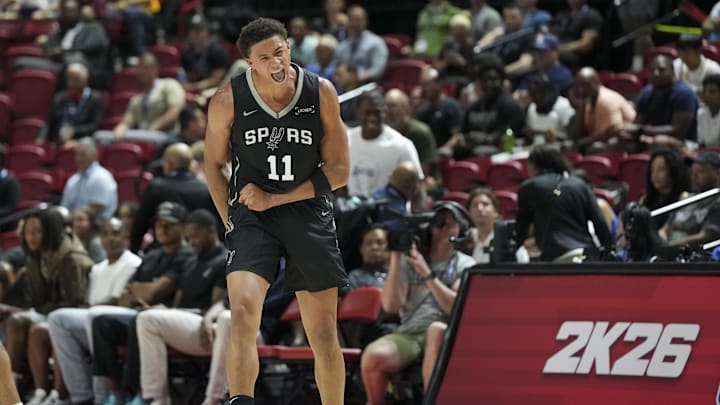 Jul 10, 2025; Las Vegas, NV, USA; San Antonio Spurs forward Carter Bryant (11) reacts to a play against the Philadelphia 76ers in the first quarter of their game at Thomas & Mack Center. Mandatory Credit: Candice Ward-Imagn Images