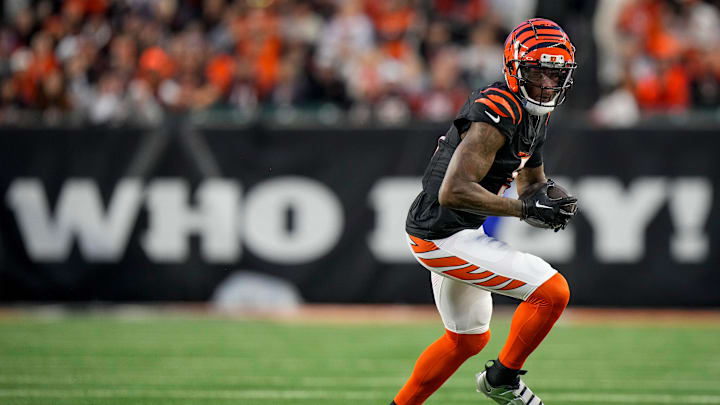 Cincinnati Bengals wide receiver Tee Higgins (5) turns with a catch in the second quarter of the NFL Week 17 game between the Cincinnati Bengals and the Denver Broncos at Paycor Stadium in downtown Cincinnati on Saturday, Dec. 28, 2024.