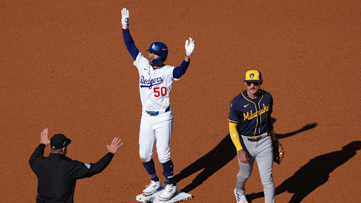 Oct 16, 2025; Los Angeles, California, USA; Los Angeles Dodgers shortstop Mookie Betts (50) reacts after hitting a RBI double against the Milwaukee Brewers in the first inning during game three of the NLCS round for the 2025 MLB playoffs at Dodger Stadium. Mandatory Credit: Kirby Lee-Imagn Images Oct 16, 2025; Los Angeles, California, USA; Los Angeles Dodgers shortstop Mookie Betts (50) reacts after hitting a RBI double against the Milwaukee Brewers in the first inning during game three of the NLCS round for the 2025 MLB playoffs at Dodger Stadium. Mandatory Credit: Kirby Lee-Imagn Images