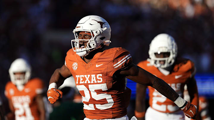 Texas Longhorns defensive back Jelani McDonald reacts after making an interception against the Kentucky Wildcats. Texas Longhorns defensive back Jelani McDonald reacts after making an interception against the Kentucky Wildcats.